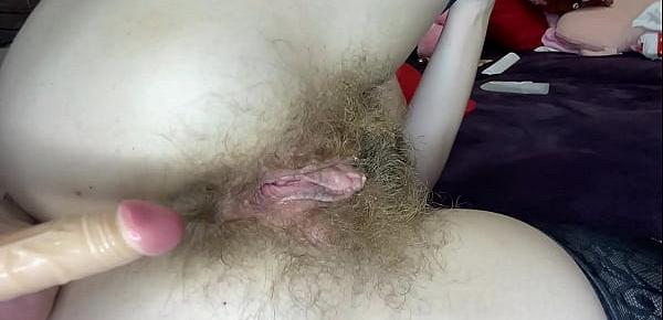  Hairy girl fucks her wet big clit pussy with dildo in close up